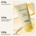 Sunny Side Up sunscreen tube with text indicating skin benefits on a light background